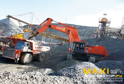 Карьерный экскаватор Hitachi EX1200-6 загружает карьерный самосвал Hitachi EH1100-3