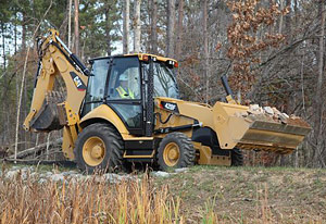 Экскаватор-погрузчик Caterpillar серии F